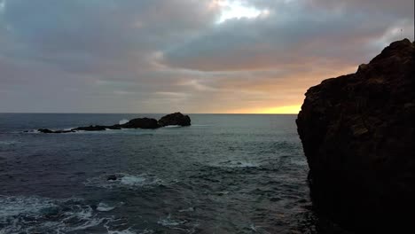 Morning-sunrise-dusk.-Sea-waves-breaking-in-the-coast.-Drone-aerial-4k-footage,-waves-crashing-over-rocks.-son-raising-on