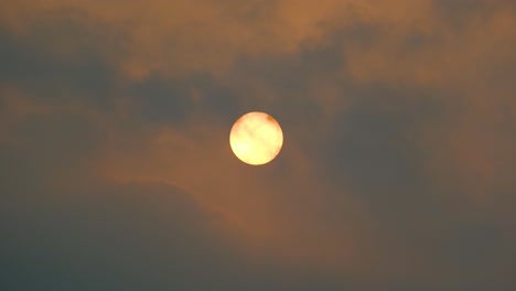 Unveiling-the-majestic-red-sun-and-passing-clouds-in-Bangladesh's-sky