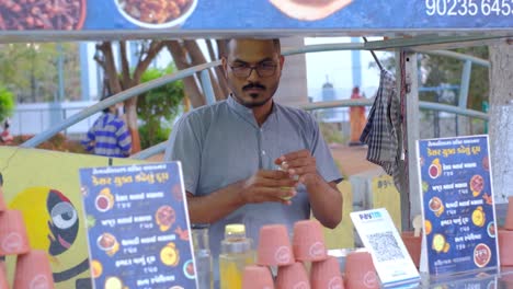Front-view-of-a-young-man-running-an-A2-milk-shop-with-organic-saffron-making-A2-milk-dish