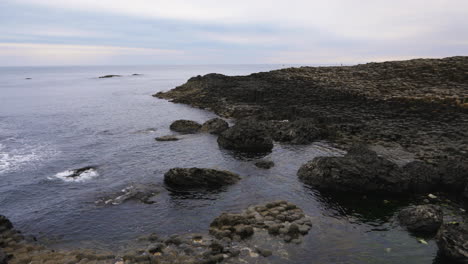 Still-shot-of-a-unique,-rocky-shoreline-by-the-North-Atlantic-Ocean-