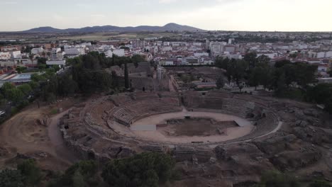 Aerial-orbit-of-impressive-ancient-roman-amphitheater,-wide-shot