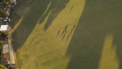 Polo-game-at-the-Argentine-Association-of-Polo-in-Buenos-Aires,-overhead-aerial