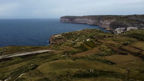 majestic-green-meadow-highlands,-cliff-hiking-route-near-ocean-sea,-calm-travel-walking-destination,-european-hike-trails,-outdoor-activity-route,-aerial-drone-shot-overview