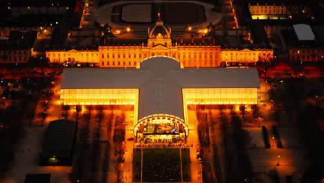 Cityscape-view-from-above-of-the-Grand-Palais-des-Champs-Elysées,-illuminated-in-the-night,-in-Paris,-France