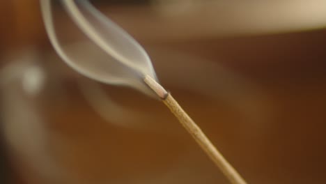 Closeup-Ignited-Incense-Smoke-Burning-in-Focus,-Spiritual-Religious-Prayer