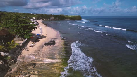 over-view-of-Balangan-beach,-a-Holiday-beach-with-blue-sky-and-ocean-with-waves-in-Bali-in-Uluwatu---Bali,-Indonesia