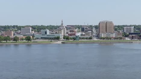 Downtown-Davenport,-Iowa-skyline-and-Mississippi-River-with-drone-video-moving-left-to-right