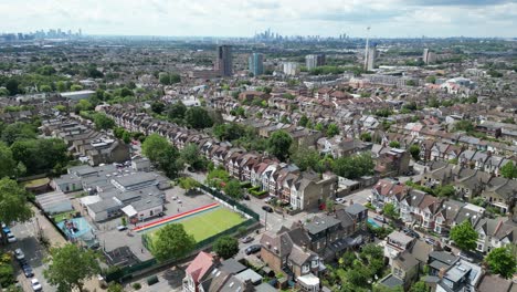 Emmanuel-Community-School-Walthamstow,-London-city-skyline-in-background-UK-drone,aerial