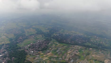 High-angle-aerial-view-of-Indonesia-landscape-with-towns-and-fields
