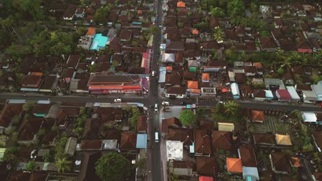 Aerial-flying-over-an-intersection-road-in-Ubud,-Bali---Indonesia