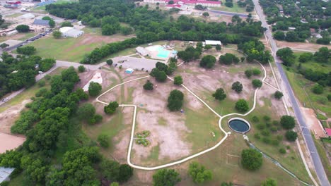 Aerial-footage-of-Hanna-Springs-Sculpture-Garden-in-Lampasas-Texas-located-at-501-E-North-Ave,-Lampasas,-TX-76550