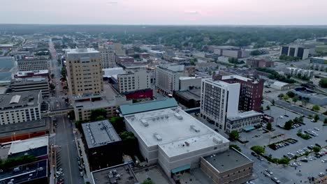Downtown-Davenport,-Iowa-with-drone-video-moving-right-to-left-at-dusk-wide-shot