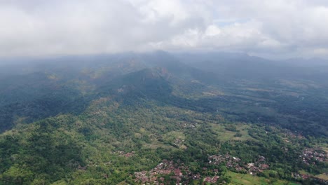 Majestic-landscape-with-mountains-and-villages-in-Indonesia,-aerial-view