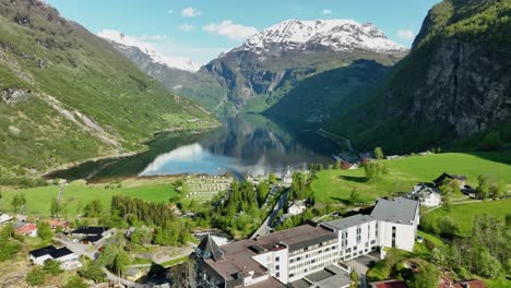 Aerial-view-of-beautiful-Geiranger,-Norway,-famous-Hotel-Union-and-fjord