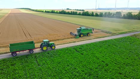 Tractor-Working-On-Agricultural-Field---aerial-drone-shot