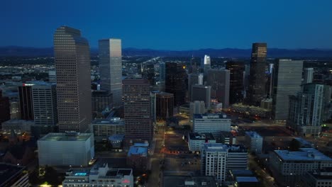 Aerial-truck-shot-of-Denver,-Colorado-skyline-during-blue-hour