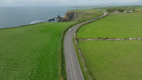 The-classic-Copper-Coast-Drive-Waterford-Ireland-a-vintage-car-driving-on-this-scenic-route-summer