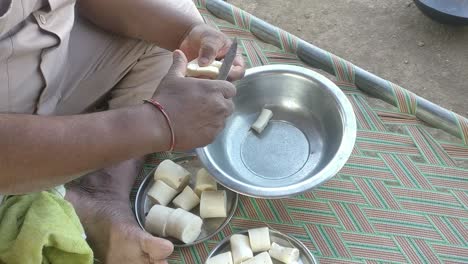 Scene-from-above-where-a-farmer-is-working-on-his-farm-making-organic-Cassava-wafers-and-slicing-them-into-small-pieces