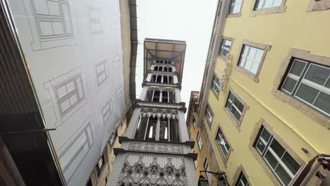 Santa-Justa-Lift-in-Lisbon,-Portugal-filmed-from-below-during-the-day