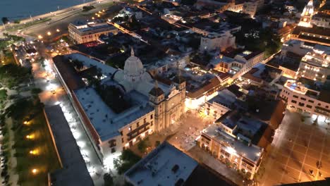 Aerial-Drone-Fly-Above-Cartagena-Colombia-at-Night,-Cathedral,-Historical-Center-Buildings,-Panoramic-City-View