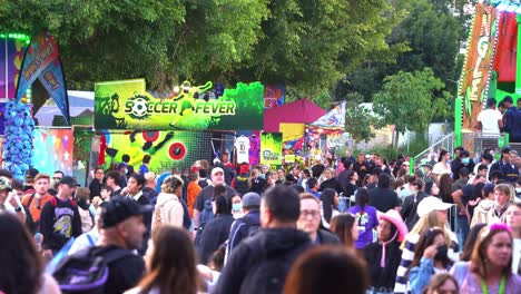 Massive-crowds-gathered-at-iconic-Ekka-annual-agricultural-exhibition,-Royal-Queensland-Show-outdoor-festival-and-carnival-rides-and-games-at-Brisbane-Showgrounds,-Bowen-Hills