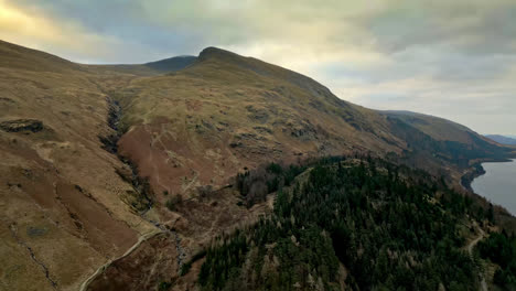 Captivating-aerial-drone-footage-showcases-the-breathtaking-Cumbrian-landscape-with-Thirlmere-Lake-nestled-among-majestic-mountains