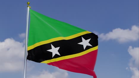 Bandera-De-Saint-Kitts-Y-Nevis-Moviéndose-En-El-Viento-Con-Un-Cielo-Azul-Claro-En-El-Fondo,-Nubes-Moviéndose-Lentamente,-Asta-De-Bandera,-Cámara-Lenta