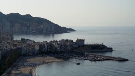 High-angle-view-of-Mediterranean-marina,-beach-and-town,-Benidorm,-morning,-4K