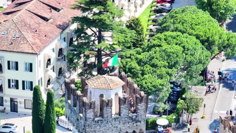 Tourists-gathered-at-Historical-Scaligero-Castle-on-top-Italy