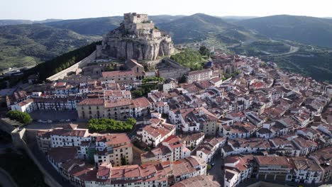 Drone-aerial-view-over-the-walled-Village-of-Morella-and-its-Castle-on-top-of-the-hill-in-Castellon-Province,-Spain
