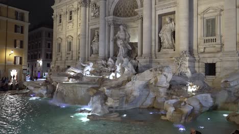 Side-View-Of-Illuminated-Trevi-Fountain-At-Night-Viewed-From-Via-della-Stamperia