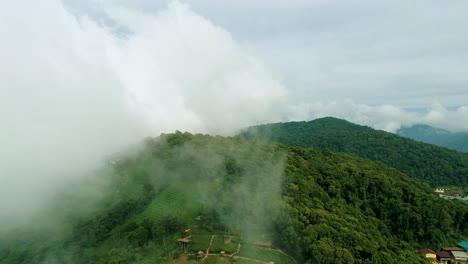 4K-Cinematic-nature-aerial-footage-of-a-drone-flying-over-the-beautiful-mountains-of-Mon-Jam-next-to-Chiang-Mai,-Thailand-on-a-sunny-day