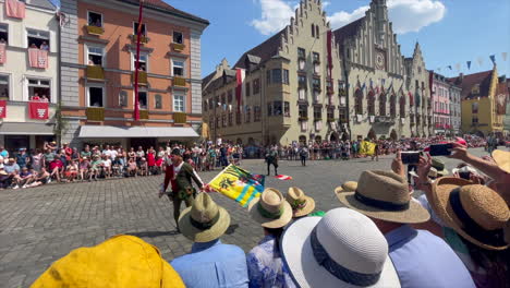 Flag-bearers-throwing-flags-at-the-Parade-at-the-Landshut-wedding,-a-historical-celebration-of-1475-that-is-reenacted-every-4-years,-Landshut,-Germany