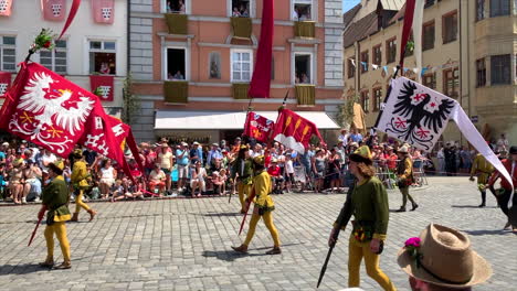 Flag-bearers-at-the-Parade-at-the-Landshut-wedding,-a-historical-celebration-of-1475-that-is-reenacted-every-4-years,-Landshut,-Germany