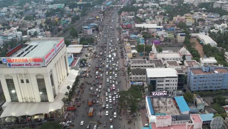 Aerial-Footage-View-Of-Car-Moving-Through-Chennai-City-Traffic