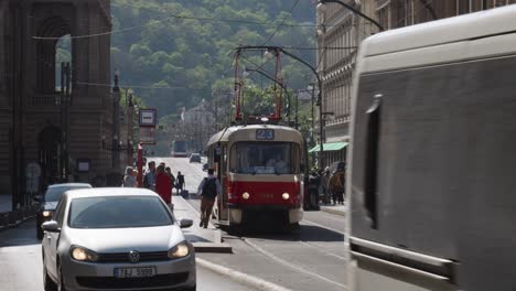 red-Tram-in-Prague-Street,-Czech-Republic