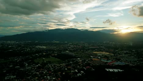 4K-Cinematic-nature-aerial-footage-of-a-drone-flying-over-the-beautiful-city-of-Chiang-Mai,-Thailand-during-sunset