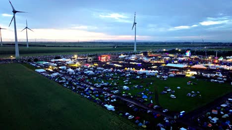 Austrian-Nova-Rock-Festival-At-Sunset-In-Pannonia-Fields-II,-Nickelsdorf,-Austria---drone-shot