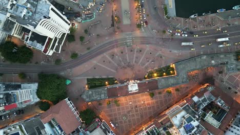 cartagena-clock-tower-monument-in-historical-city-center-with-ancient-wall-aerial-top-down-illuminated,-Colombia-travel-destination-on-Caribbean-Sea
