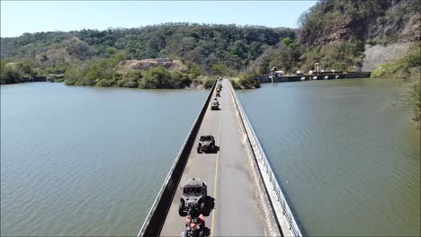 long-bridge-over-lake,-SIDE-BY-SIDE-over-bridge-,-CAN-AM,-UTV-Off-Road-Extreme-Racing,-Rally-race,-Polaris,-SIDE-BY-SIDE,-SXS,-ATV