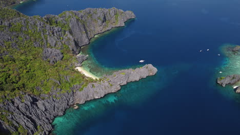 Turquoise-waters-off-the-coast-of-Palawan,-Philippines-High-Aerial