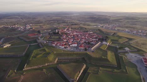 Wide-shot-of-medieval-town-Almeida-Portugal-during-sunrise-with-soft-light,-aerial