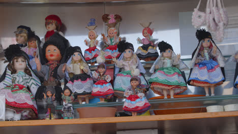 Toy-dolls-in-Nazare,-Portugal-for-sale-in-town-center