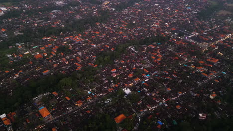 Panoramic-aerial-view-of-the-overcrowded-city-of-Ubud,-climate-crisis-due-to-deforestation-and-air-pollution,-Indonesia