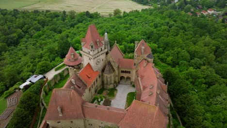 Famous-Kreuzenstein-Castle-And-Ruin-In-Leobendorf,-Austria---aerial-drone-shot
