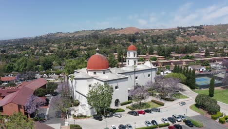 Low-panning-aerial-shot-of-the-Mission-Basilica-in-San-Juan-Capistrano,-California