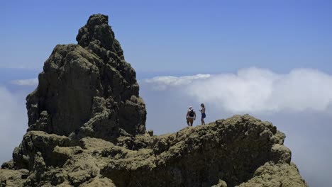 Couple-Taking-Pictures-At-Pico-de-las-Nieves-Viewpoint-With-Bed-Of-Clouds-In-Background-During-Daytime-In-Gran-Canaria,-Spain