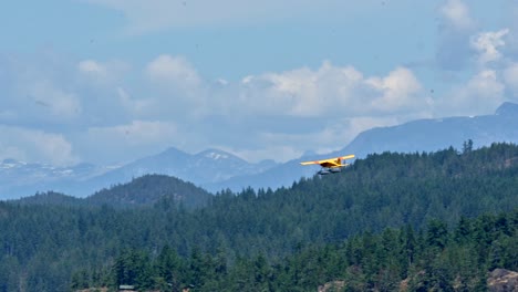 Floatplane-flying-over-Quadra-Island-in-BC