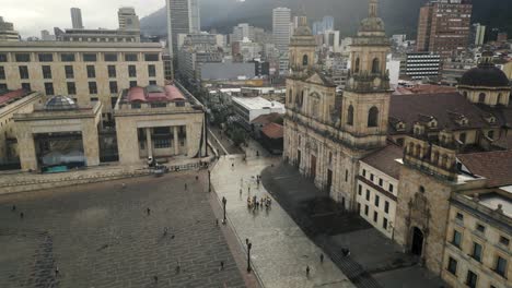 Drone-Shot-of-Historic-Downtown-of-Bogota,-Colombia,-People-on-Bolivar-Square-in-Front-of-Cathedral