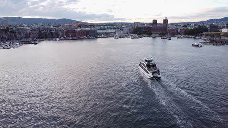 Approaching-Aerial-View-of-Passenger-Ferry-in-Oslo-Harbour-Golden-Hour